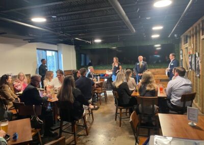 Diana speaking during networking event.