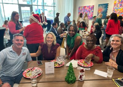 People sitting at table during Holiday party