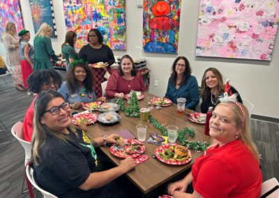 People enjoying food during the Thrive by Five holiday party