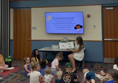 Diana reads a book to children at Largo Public Library