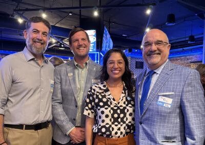 Businesspeople pose for photo at the networking event.